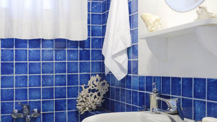 Blue Interior in Bathroom And White Sink Closeup